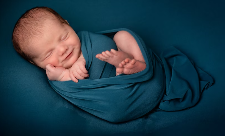 Baby swaddled in blue cloth